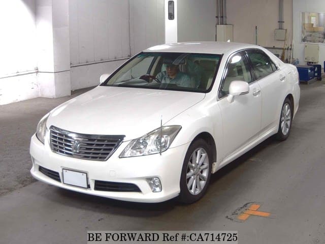 A grey JDM sports car speeding down a highway at night.