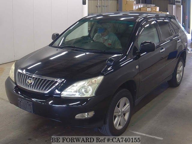 A grey JDM sports car speeding down a highway at night.
