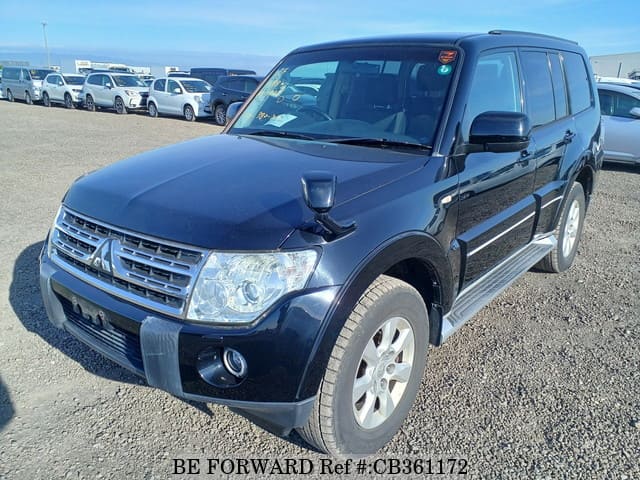 A grey JDM sports car speeding down a highway at night.