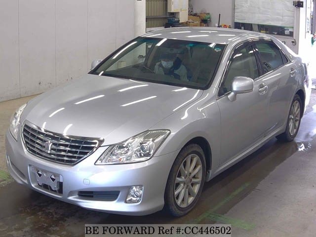 A grey JDM sports car speeding down a highway at night.