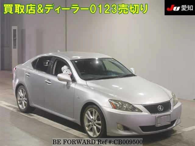 A grey JDM sports car speeding down a highway at night.