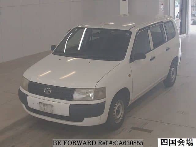 A grey JDM sports car speeding down a highway at night.