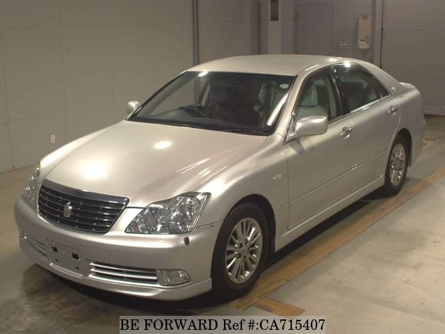 A grey JDM sports car speeding down a highway at night.