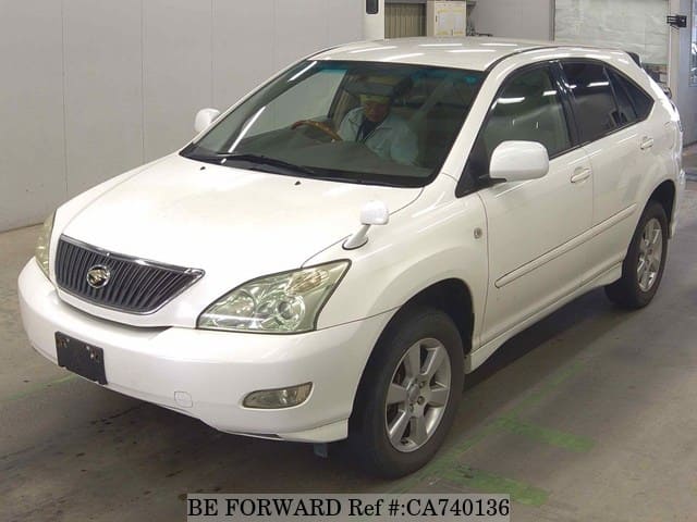 A grey JDM sports car speeding down a highway at night.