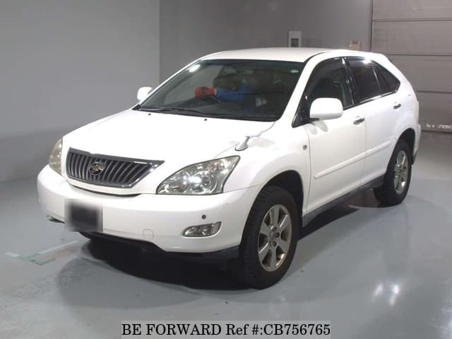 A grey JDM sports car speeding down a highway at night.