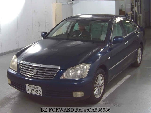 A grey JDM sports car speeding down a highway at night.