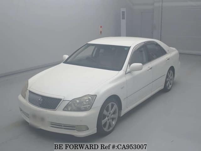 A grey JDM sports car speeding down a highway at night.