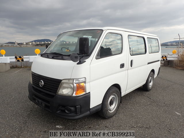 A grey JDM sports car speeding down a highway at night.