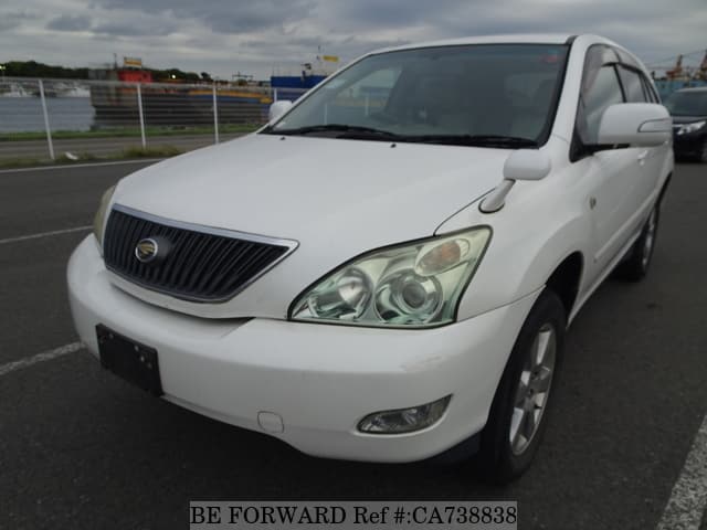 A grey JDM sports car speeding down a highway at night.