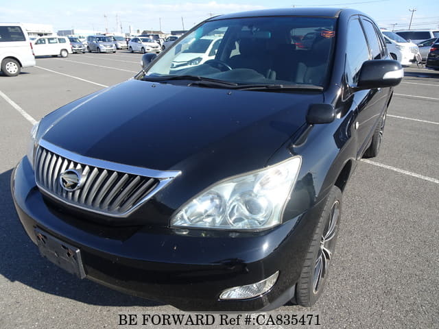 A grey JDM sports car speeding down a highway at night.