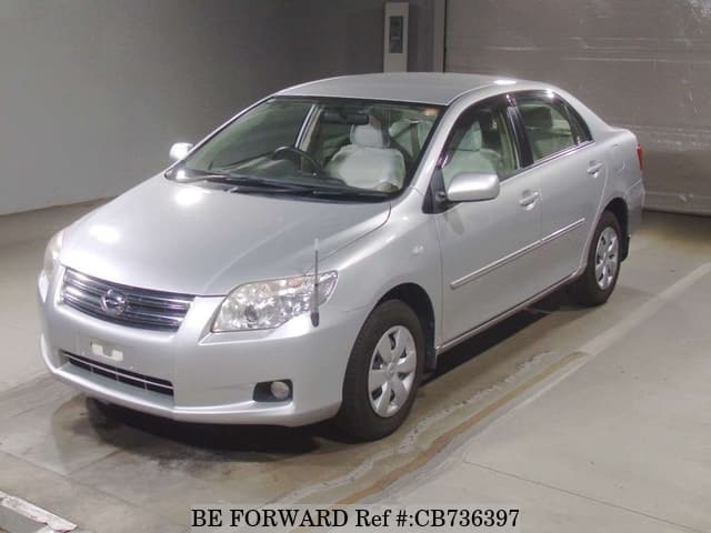 A grey JDM sports car speeding down a highway at night.