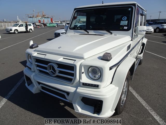 A grey JDM sports car speeding down a highway at night.