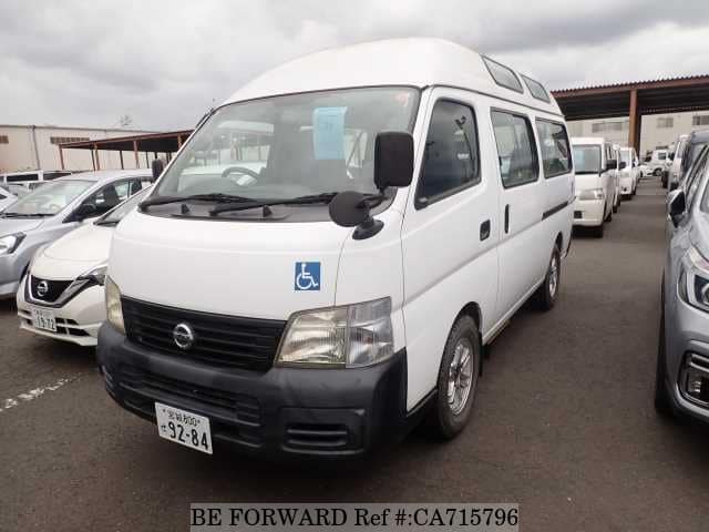 A grey JDM sports car speeding down a highway at night.