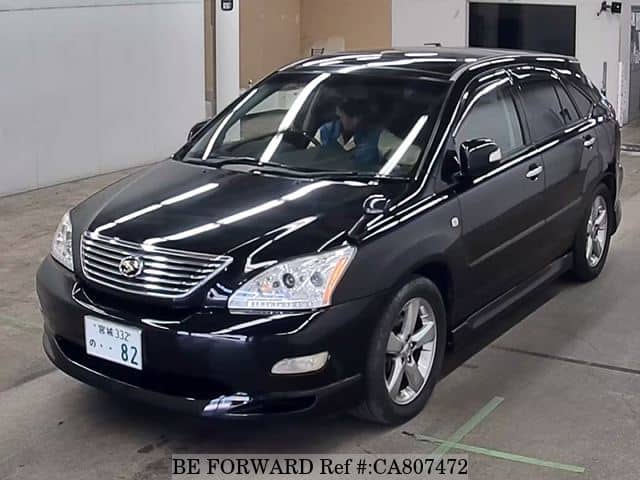 A grey JDM sports car speeding down a highway at night.