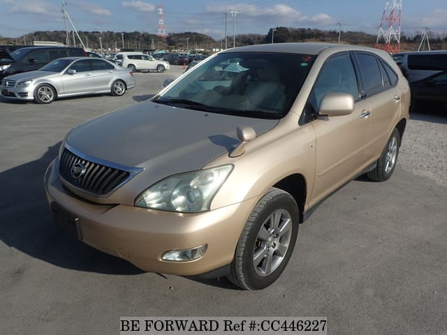 A grey JDM sports car speeding down a highway at night.