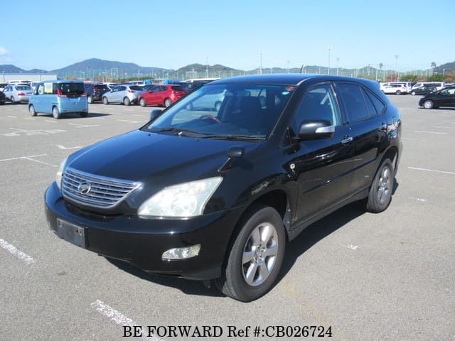 A grey JDM sports car speeding down a highway at night.