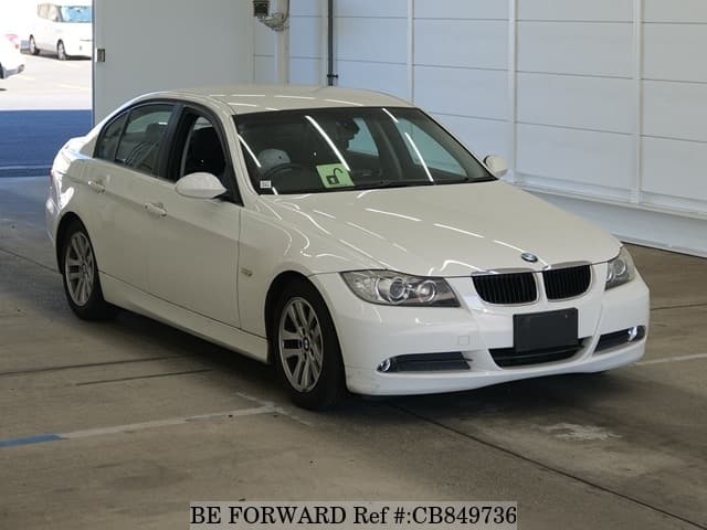 A grey JDM sports car speeding down a highway at night.