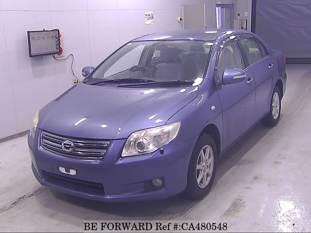 A grey JDM sports car speeding down a highway at night.