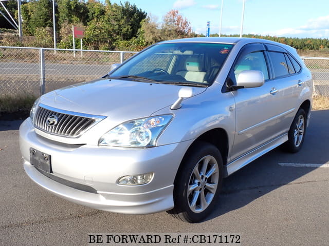 A grey JDM sports car speeding down a highway at night.