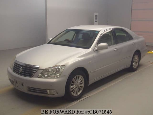 A grey JDM sports car speeding down a highway at night.