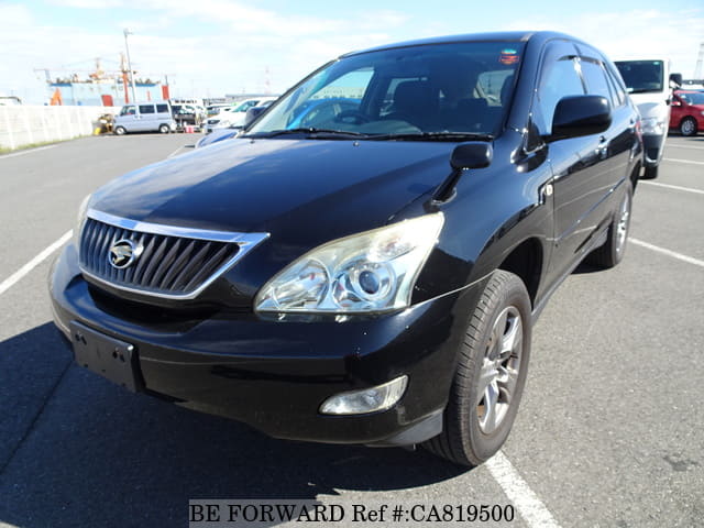 A grey JDM sports car speeding down a highway at night.
