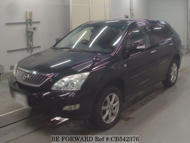 A grey JDM sports car speeding down a highway at night.
