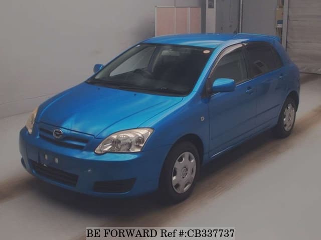 A grey JDM sports car speeding down a highway at night.