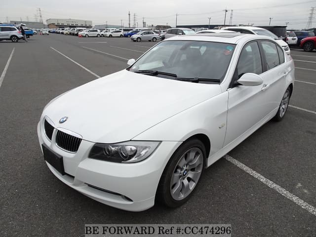 A grey JDM sports car speeding down a highway at night.