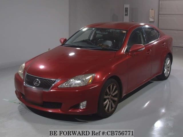 A grey JDM sports car speeding down a highway at night.