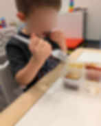 autistic child in feeding therapy trying new foods