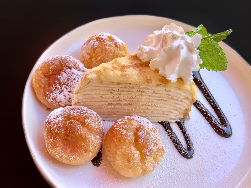 Cake. Dessert. Crepe. Custard. Whipped cream. Food. Cream Puff. Restaurant.