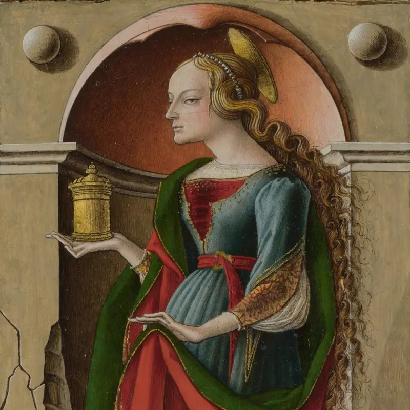 Medieval painting of Mary Magdalene in profile holding golden ointment jar, with long flowing wavy blonde hair and ornate green-red gown in arched niche, classic historical depiction of long natural hair in Renaissance art.