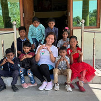 Children from Haven of Hope in India gathered together with volunteers during an outreach visit