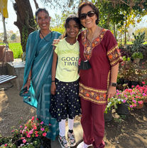 Mrs. Joey del Prado visiting a Haven of Hope student with a disability during a community outreach in India
