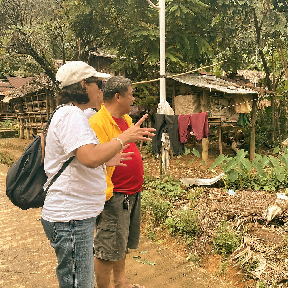 Mission team engaging with the Mangyan community during a site visit in Oriental Mindoro, Philippines.