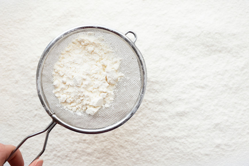 sifter-with-flour-on-white-background-top-view-c-2023-11-27-05-16-06-utc.jpg