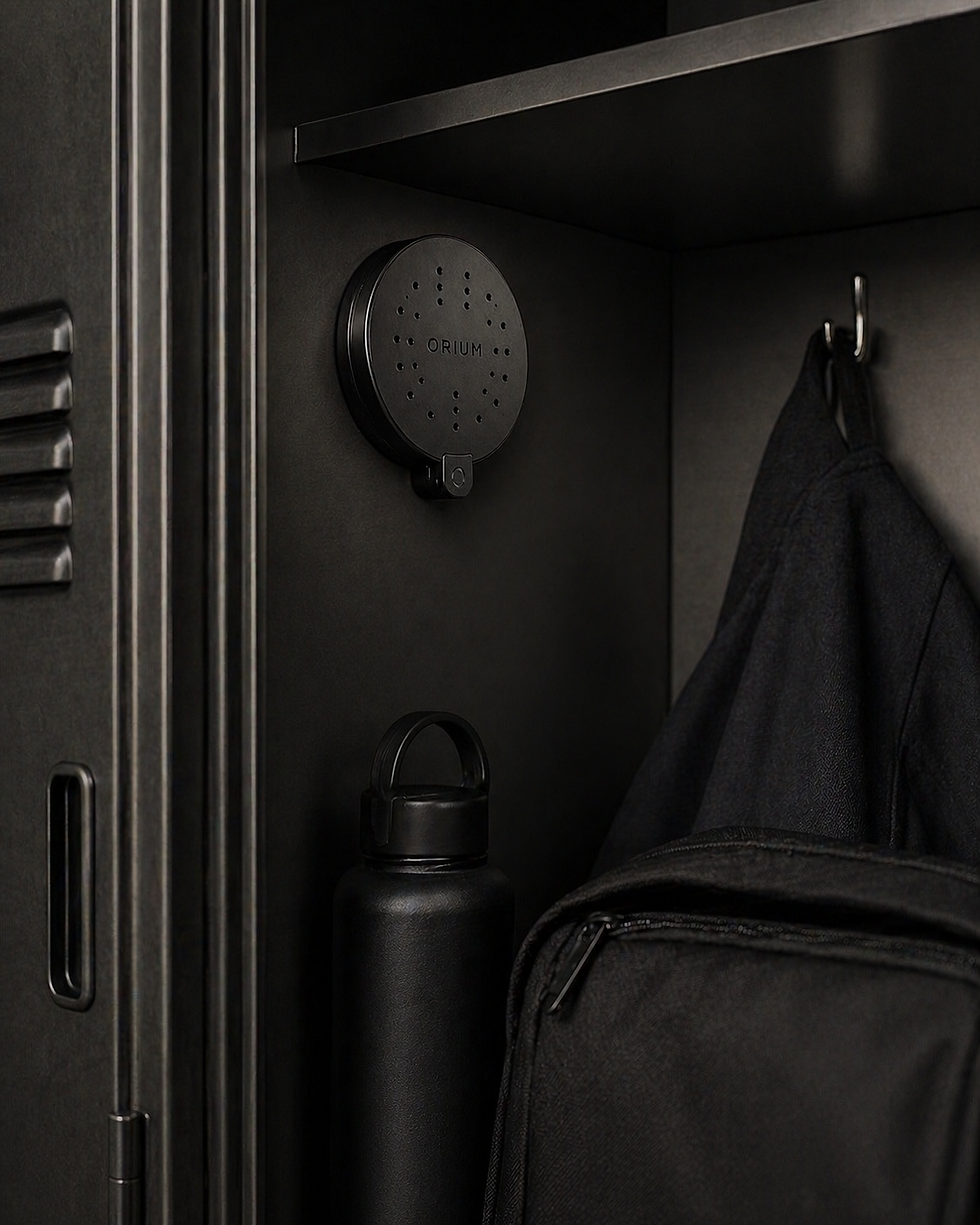 Thumbnail: ORIUM scent patch inside a locker with a bottle and bag