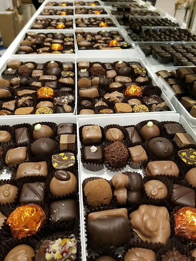 2 Boxes of Bon Bons Chocolates being fil