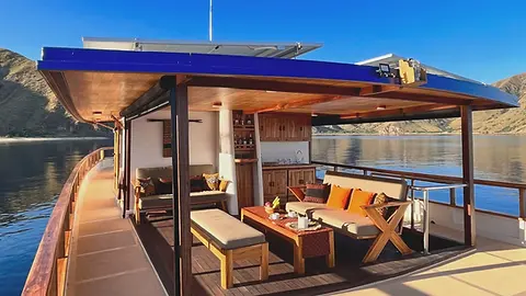 a-boats-lounge-area-with-seating-and-ocean-views-scaled.webp