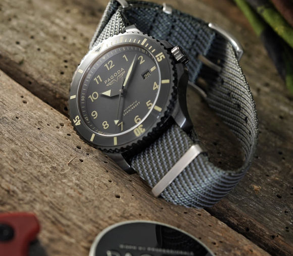 Pagoda tactical watch with engraved backplate showing Union Jack and Stars & Stripes—veteran-owned brand built for elite performance and military heritage.