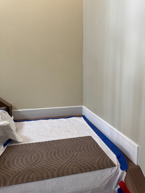 White baseboards installed along a long interior wall in Boyle, Alberta