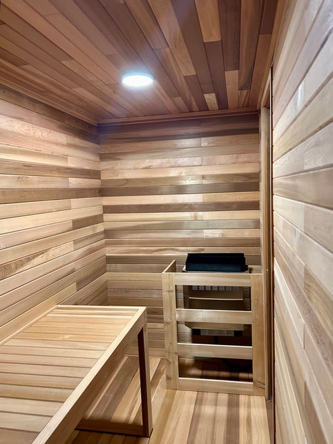 Cedar sauna with installed heater and lighting in Edmonton
