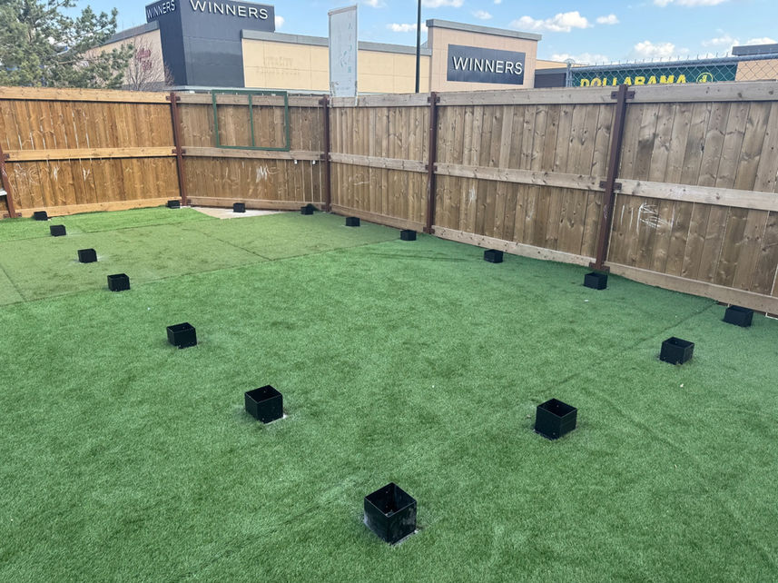 Pergola post bases positioned and aligned for custom pergola construction in Edmonton
