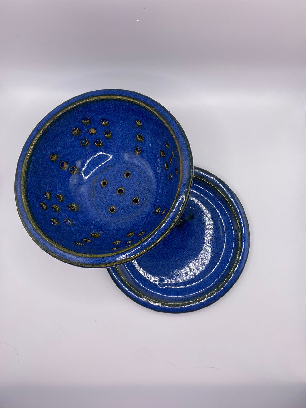 Blue ceramic berry colander and plate