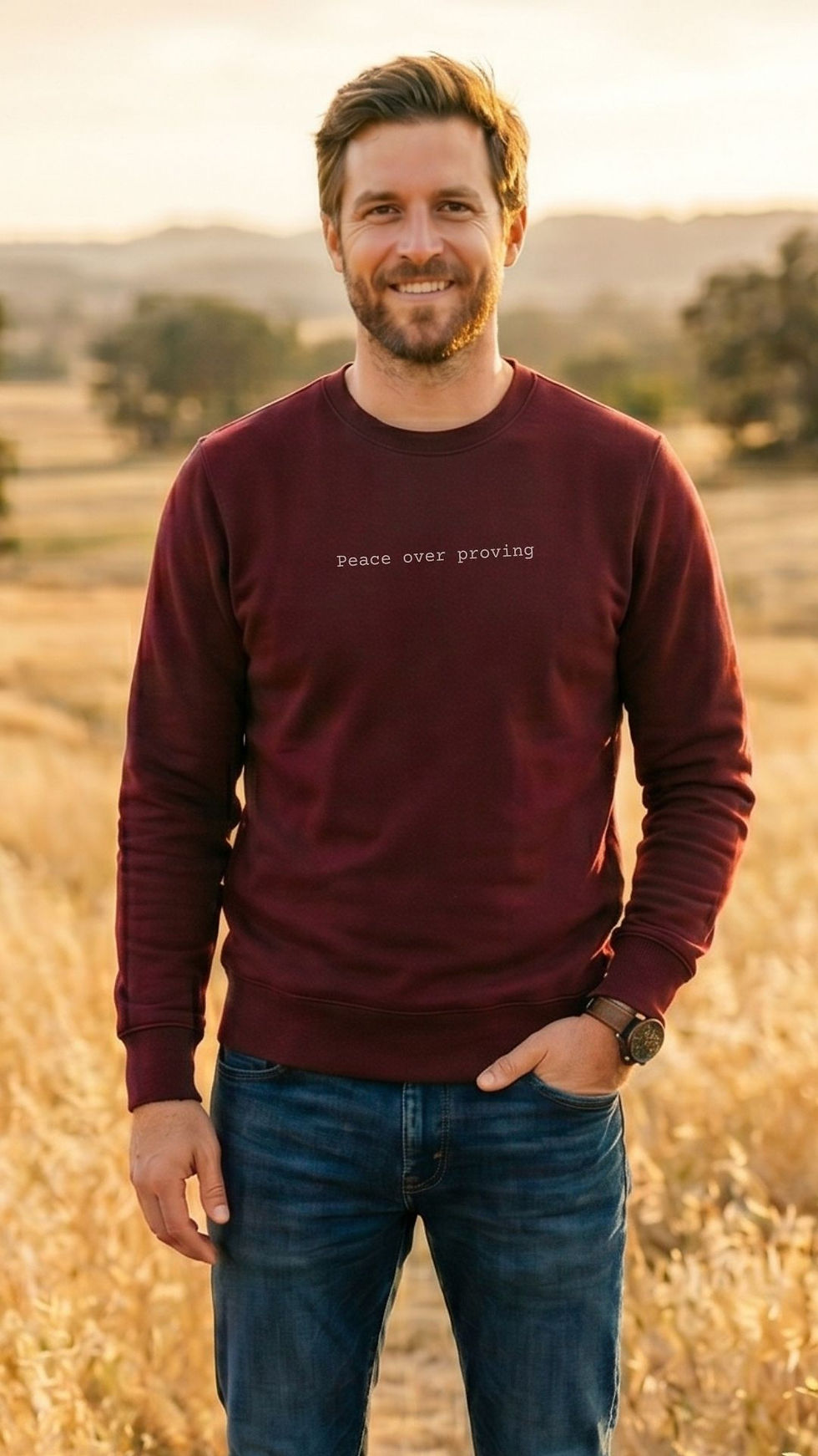man wearing maroon "Peace Over Proving" Soul-Aligned Minimalist Awakening Sweatshirt_VISUAL AWAKENING ART