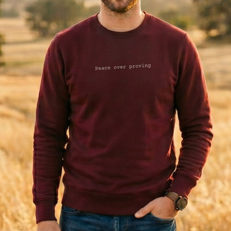 man wearing maroon "Peace Over Proving" Soul-Aligned Minimalist Awakening Sweatshirt_VISUAL AWAKENING ART