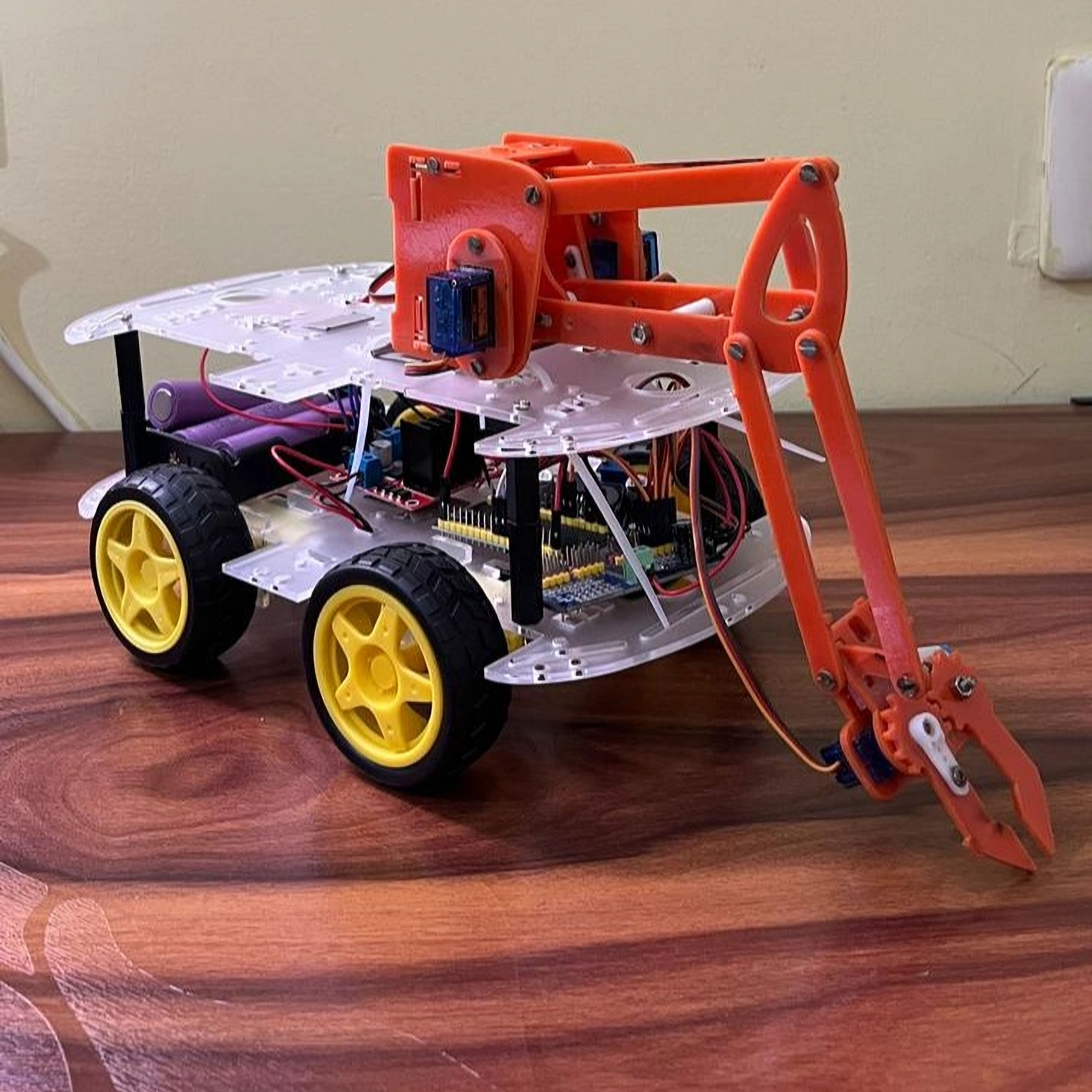 Android Controlled Robotic Arm Vehicle
