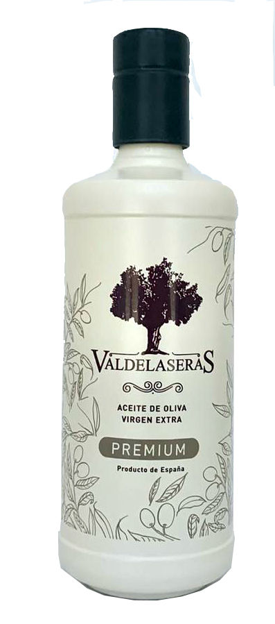 Botellas De Aceite De Oliva Y Pico Vertedor Sobre Una Mesa | Foto Premium