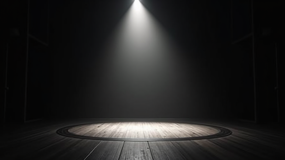 Eye-level view of a theater stage with a single spotlight