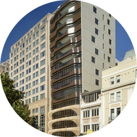 Exterior view of a tall modern building with brown accents and Carrington Place.